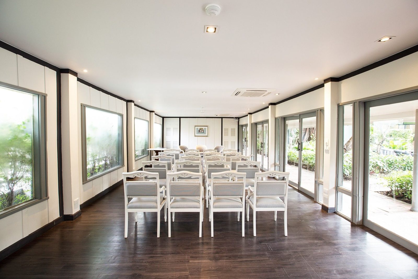 Meeting room set with boardroom-style tables at The Raweekanlaya Bangkok