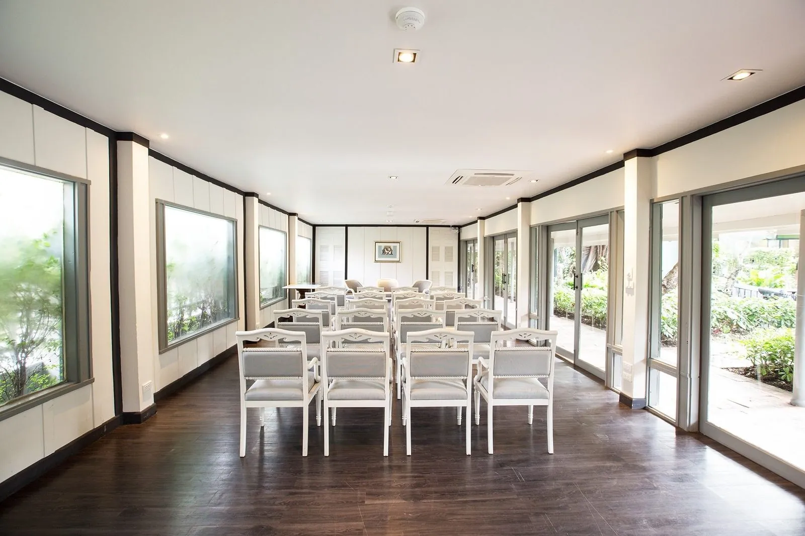 Meeting room set with boardroom-style tables at The Raweekanlaya Bangkok