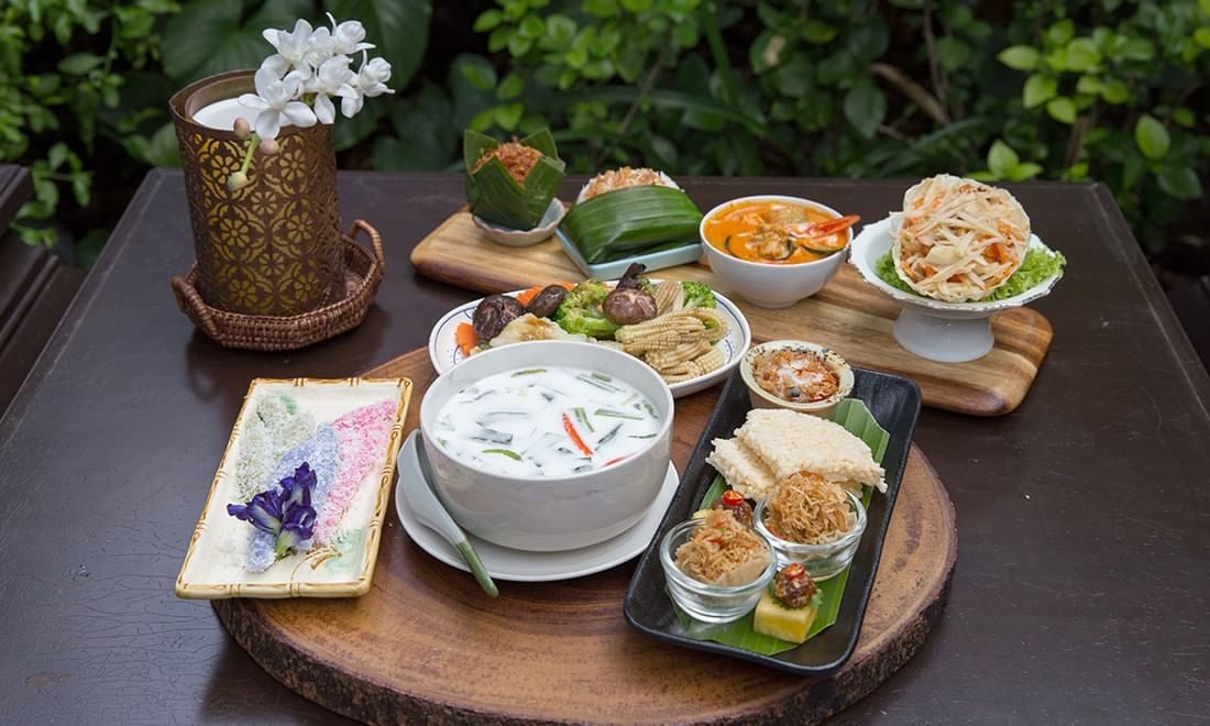 Thai set menu dishes served in the garden at The Raweekanlaya Bangkok