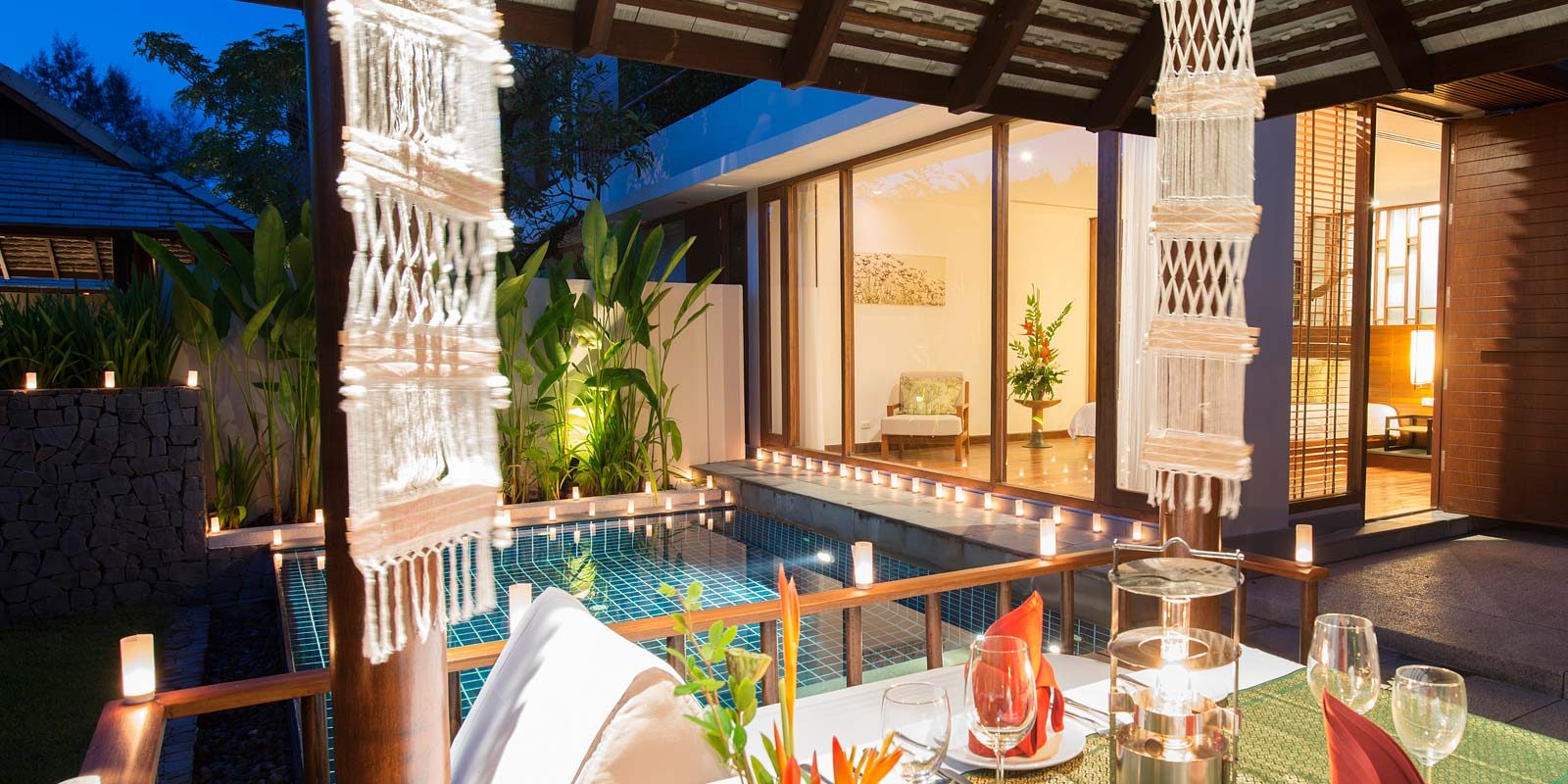 Private pool and terrace of a 2-Bedroom Pool Residence at The Sarojin at dusk