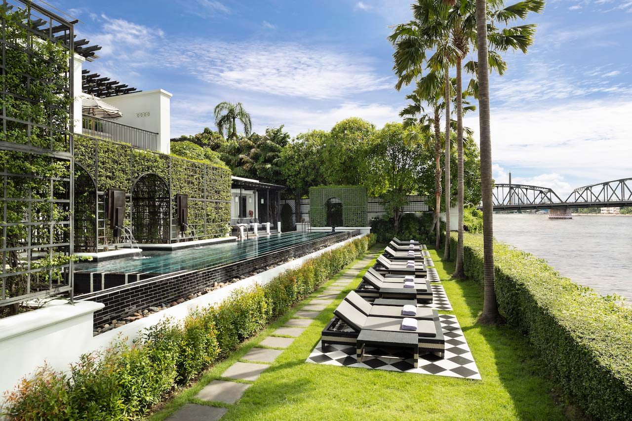 Infinity pool and lawn beside the Chao Phraya River at The Siam, Bangkok