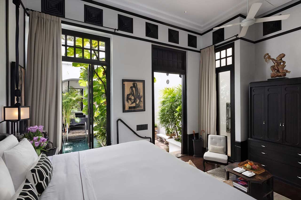 Riverside Pool Villa bedroom opening onto its private pool at The Siam, Bangkok