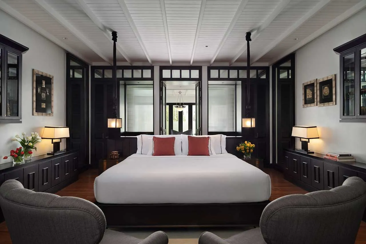 Siam Suite bedroom with king bed and Art Deco details at The Siam, Bangkok