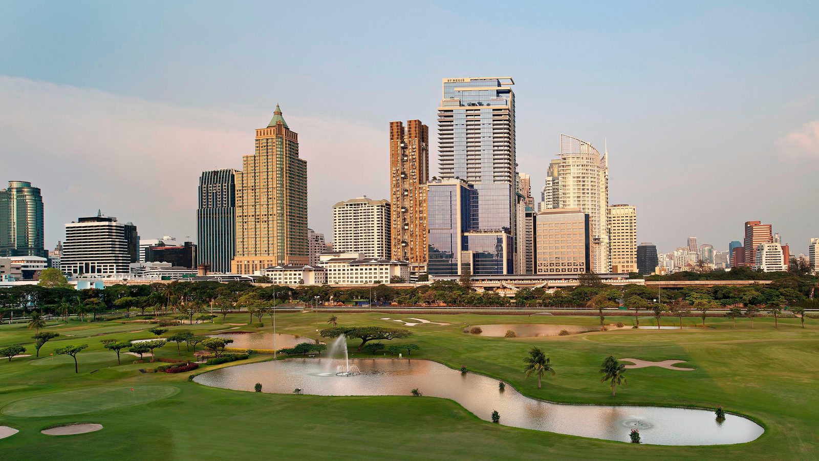 Royal Bangkok Sports Club golf course and the city skyline beside The St. Regis Bangkok