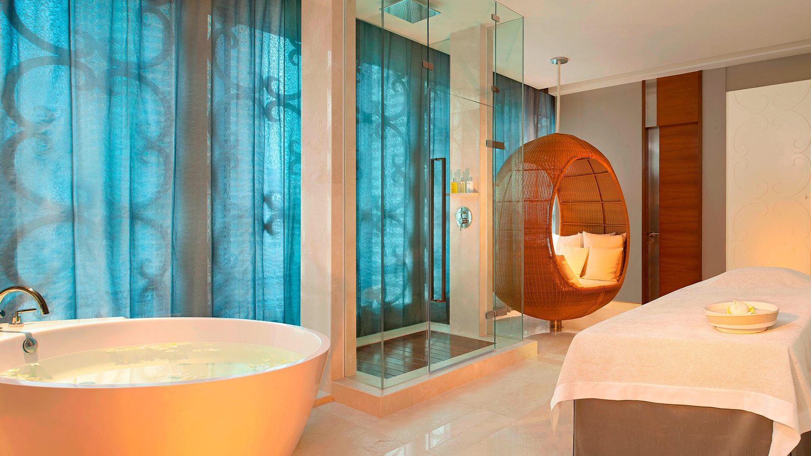 Spa treatment room with a freestanding bathtub at The St. Regis Bangkok