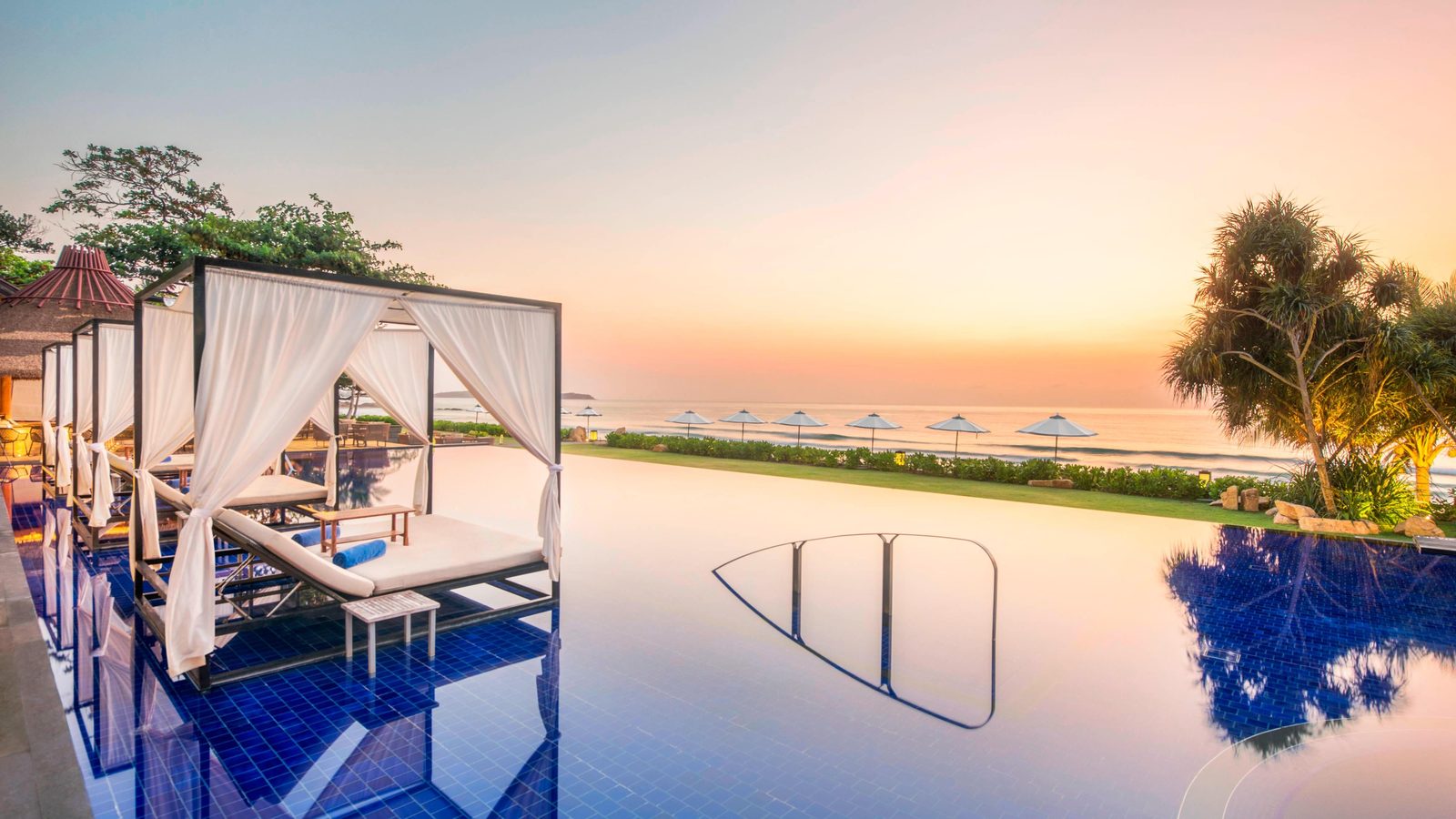 Infinity-edge pool with cabanas looking over the Gulf of Thailand at Vana Belle, Koh Samui