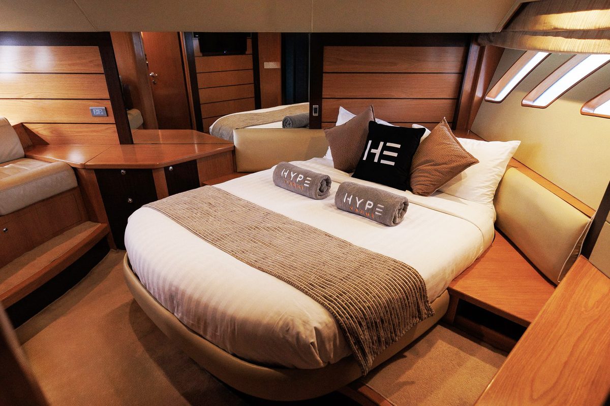 The HYPE Yacht master suite with HE-branded headboard