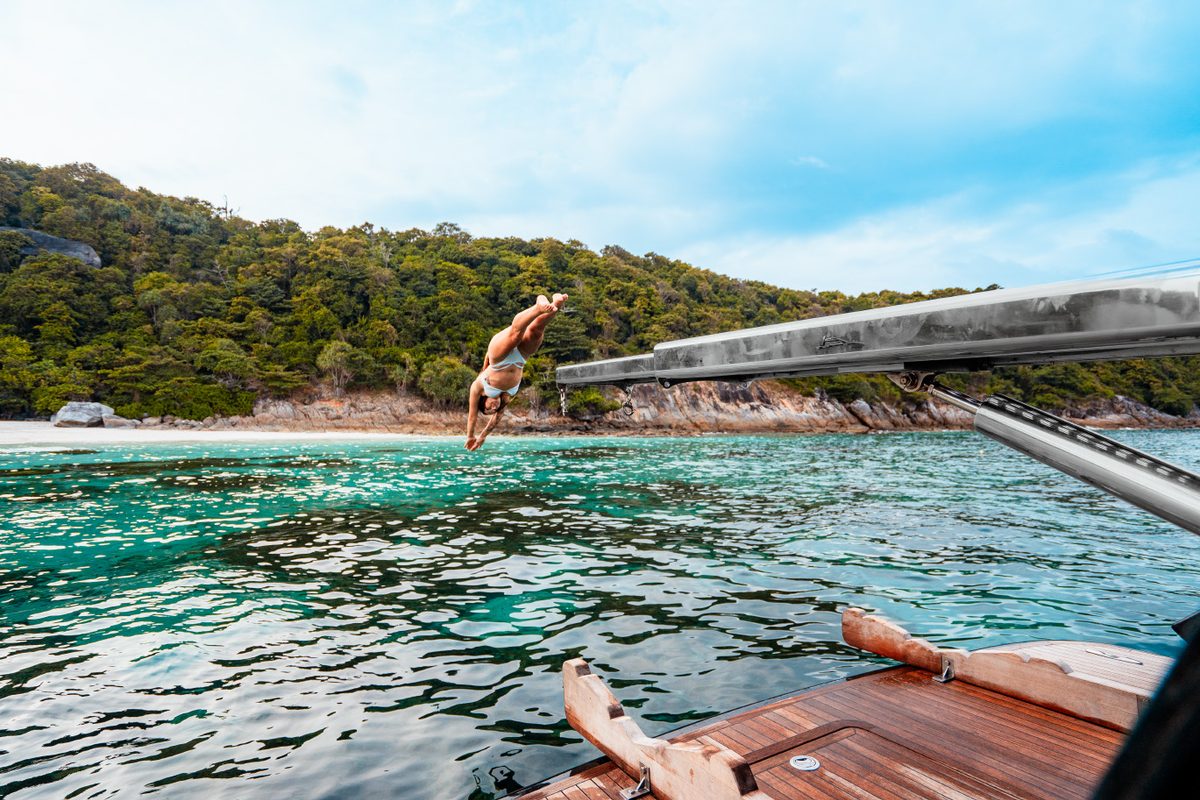 Guests swimming from the HYPE Yacht in clear Andaman water