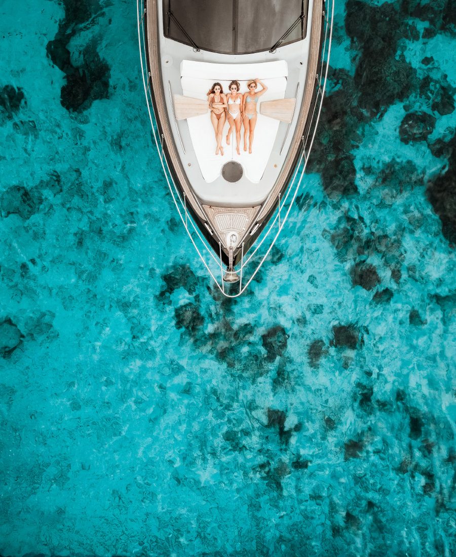 Aerial view of the HYPE 55 yacht over turquoise water off Phuket