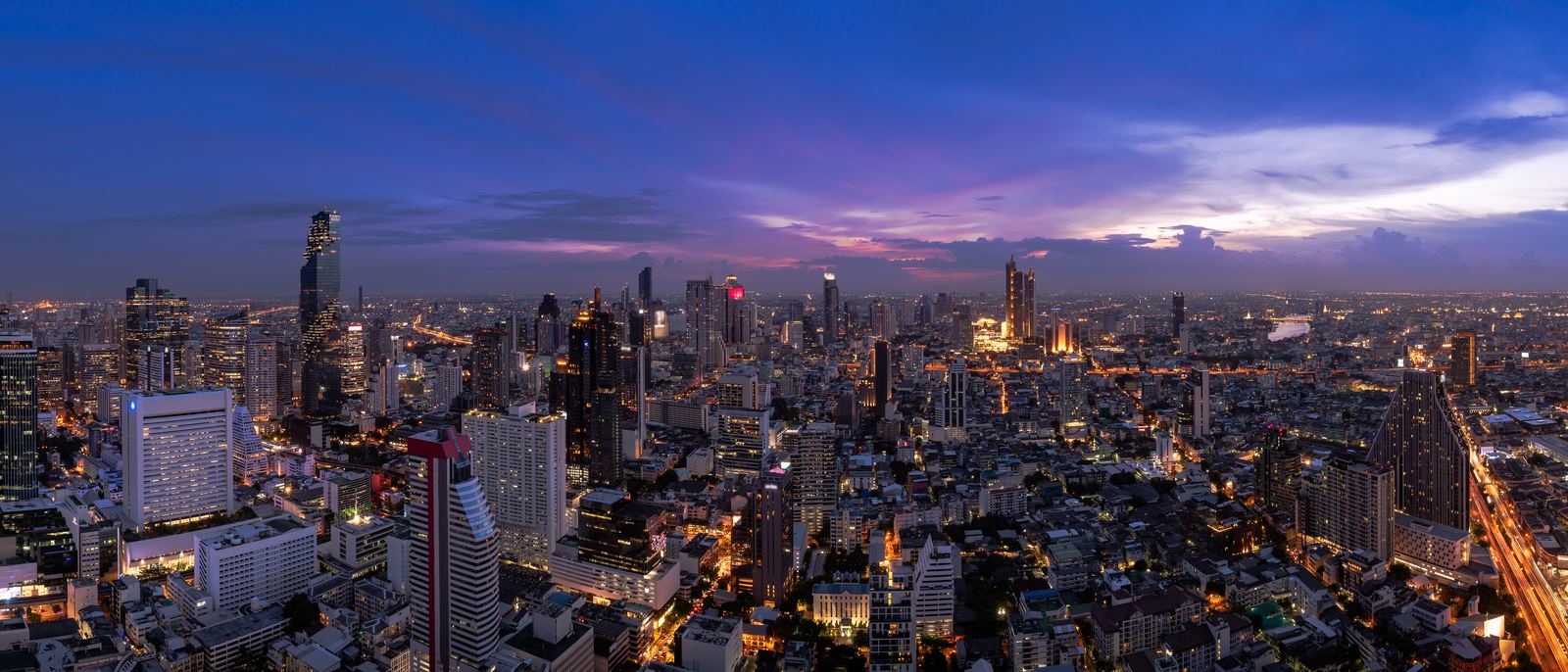 Bangkok business district at twilight — home of Explera DMC Thailand