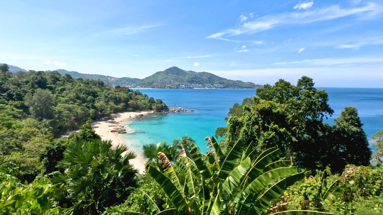 Aerial view of a tropical Phuket beach with turquoise sea — the islands leg of a Thailand itinerary