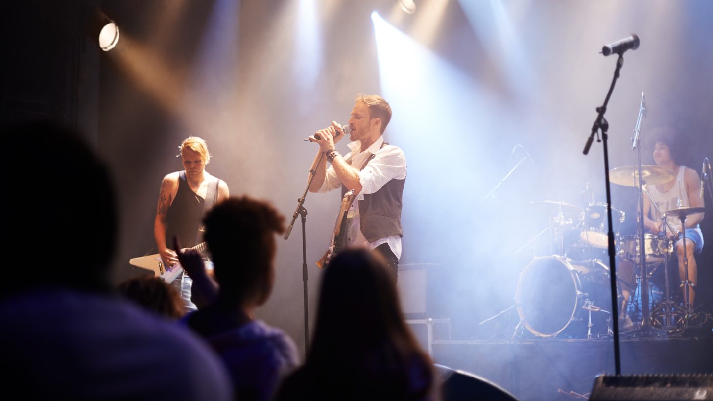 International artist performing on stage at a corporate event in Thailand